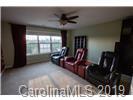 148 Roanoke Road Fletcher, NC 28732 - Photo 17 of 33 a living room with furniture and a fireplace