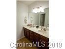 148 Roanoke Road Fletcher, NC 28732 - Photo 21 of 33 a bathroom with a sink and a mirror