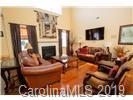 148 Roanoke Road Fletcher, NC 28732 - Photo 6 of 33 a living room with furniture and a flat screen tv
