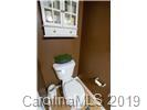 148 Roanoke Road Fletcher, NC 28732 - Photo 8 of 33 a bathroom with a toilet and a sink