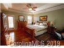 148 Roanoke Road Fletcher, NC 28732 - Photo 10 of 33 a bedroom with a bed and a night stand