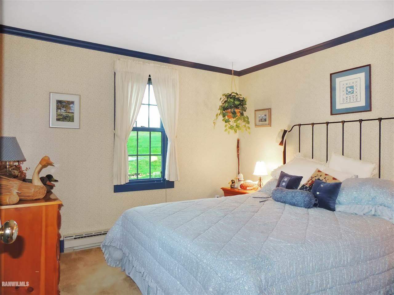 21 Thatcher Lane Galena, IL 61036 - Photo 11 of 25 a bedroom with bed and window