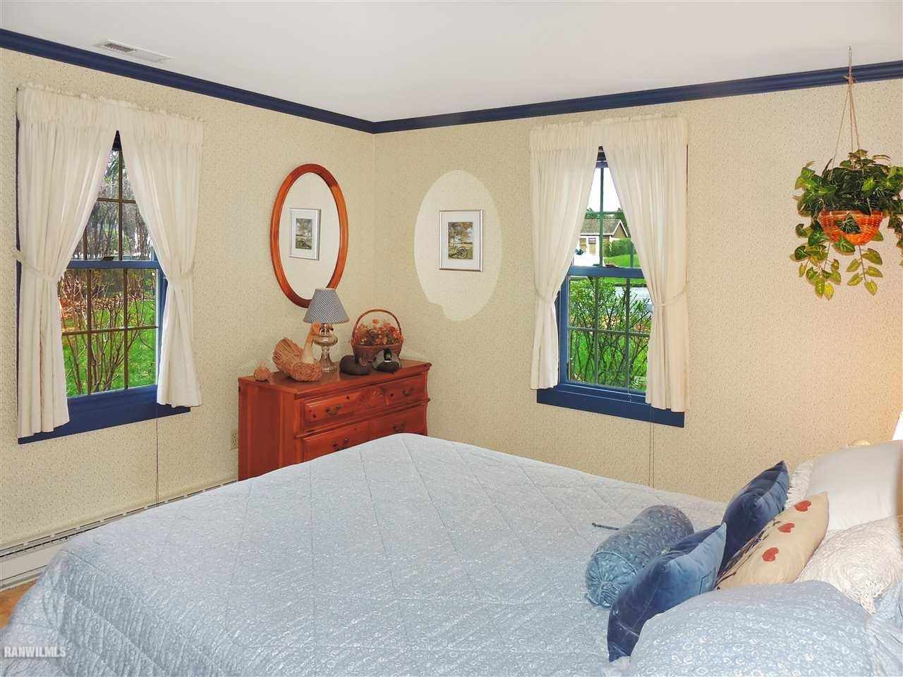 21 Thatcher Lane Galena, IL 61036 - Photo 12 of 25 a bedroom with a bed and a window