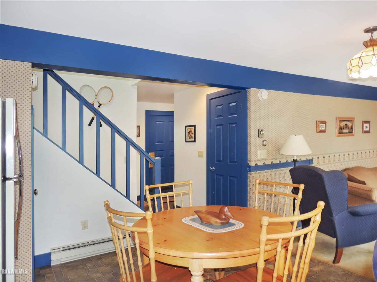 21 Thatcher Lane Galena, IL 61036 - Photo 6 of 25 a view of a dining room with furniture a potted plant and wooden floor