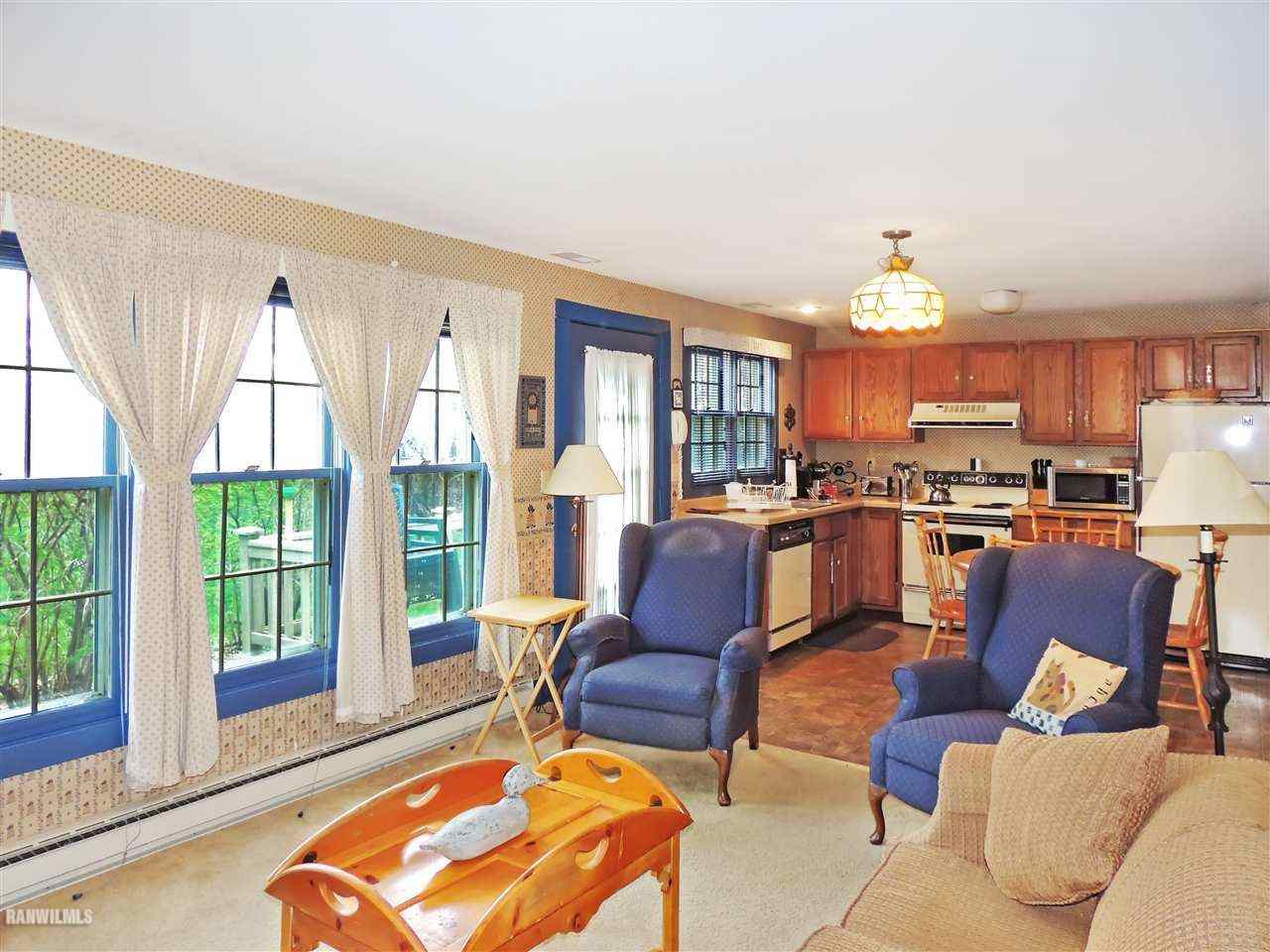 21 Thatcher Lane Galena, IL 61036 - Photo 9 of 25 a living room with furniture and a large window