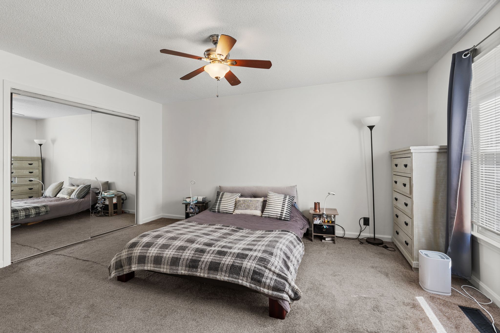 2511 Wellington Place Murfreesboro, TN 37128 - Photo 23 of 31 a bedroom with a bed and a chandelier