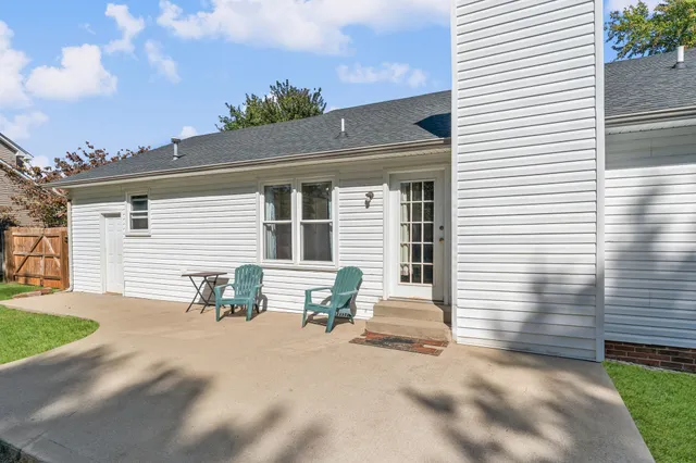 a view of yard with swimming pool and green space