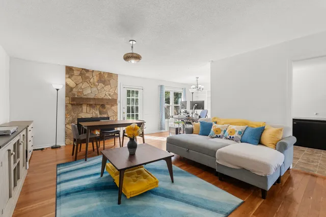 a living room with furniture and a table