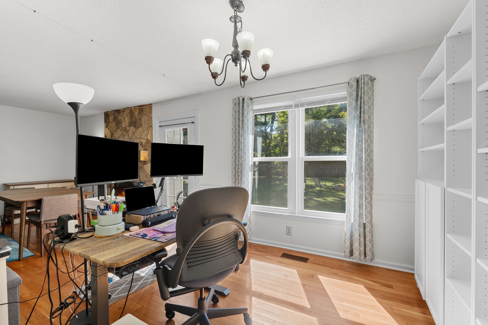 2511 Wellington Place Murfreesboro, TN 37128 - Photo 9 of 31 a living room with furniture a flat screen tv and a window