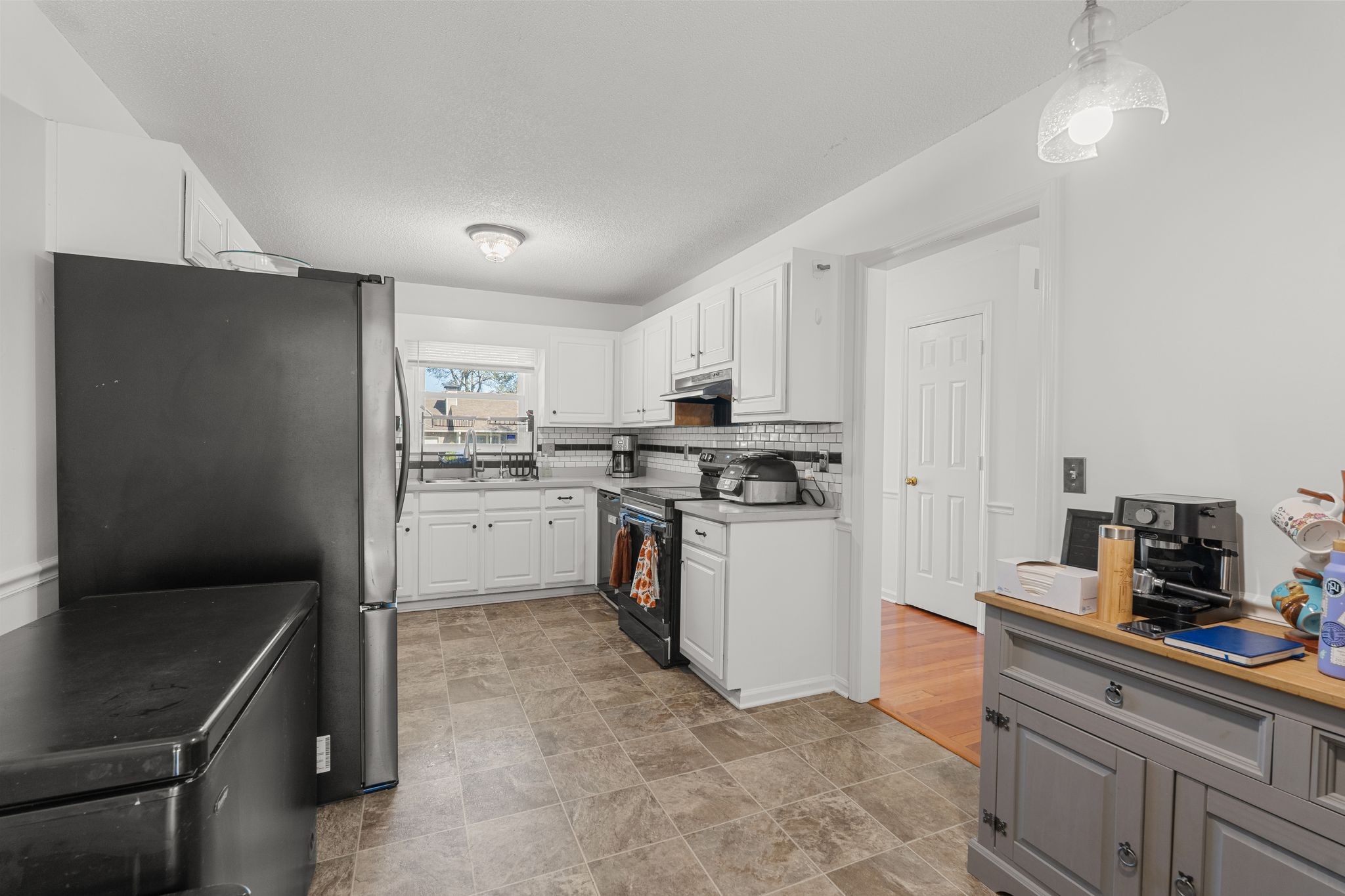 2511 Wellington Place Murfreesboro, TN 37128 - Photo 10 of 31 a kitchen with white cabinets and white appliances