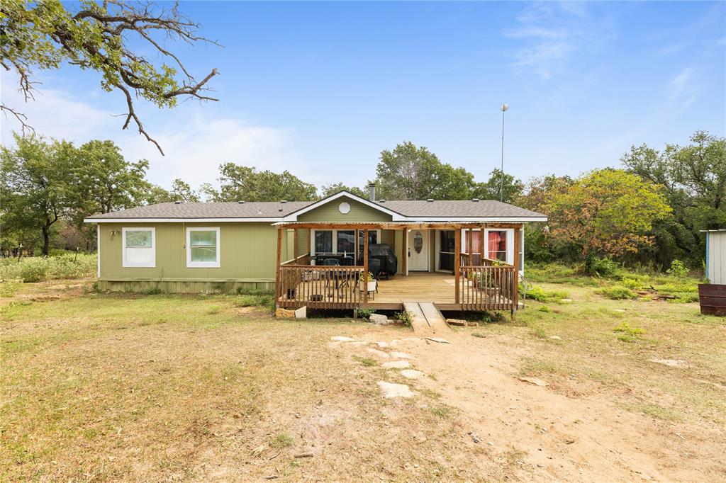 860 Scott Road Weatherford, TX 76088 - Photo 1 of 1 View of front facade with a wooden deck
