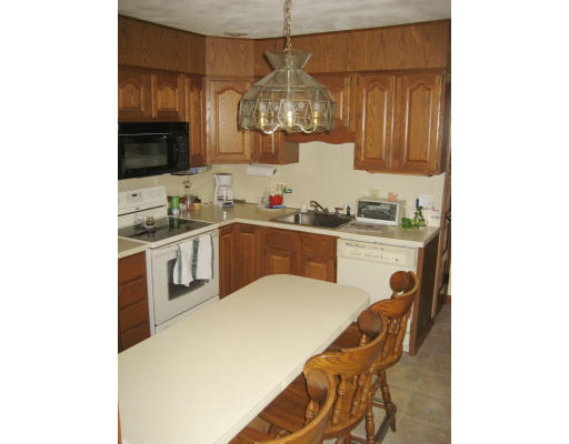33 Sunapee Street Springfield, MA 01108 - Photo 8 of 17 a kitchen with a sink cabinets and stainless steel appliances