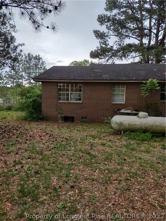 264 Freeman Mill Road Hamlet, NC 28345 - Photo 12 of 18 a front view of a house with a garden
