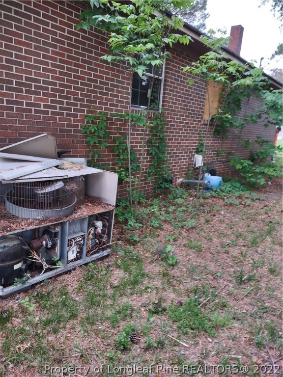 264 Freeman Mill Road Hamlet, NC 28345 - Photo 15 of 18 a view of a backyard with chairs