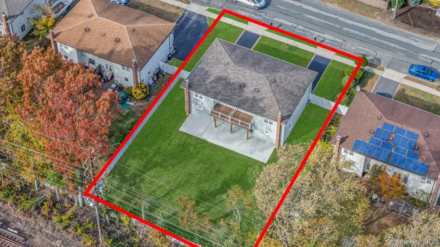 an aerial view of residential building and parking