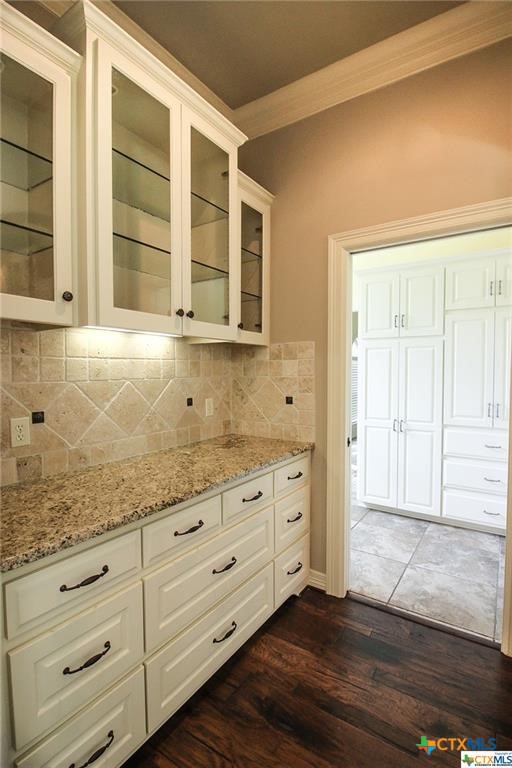 10286 Hartrick Bluff Road Temple, TX 76502 - Photo 21 of 46 a bathroom with a granite countertop sink and mirror