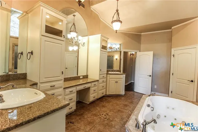 a bathroom with a tub and shower