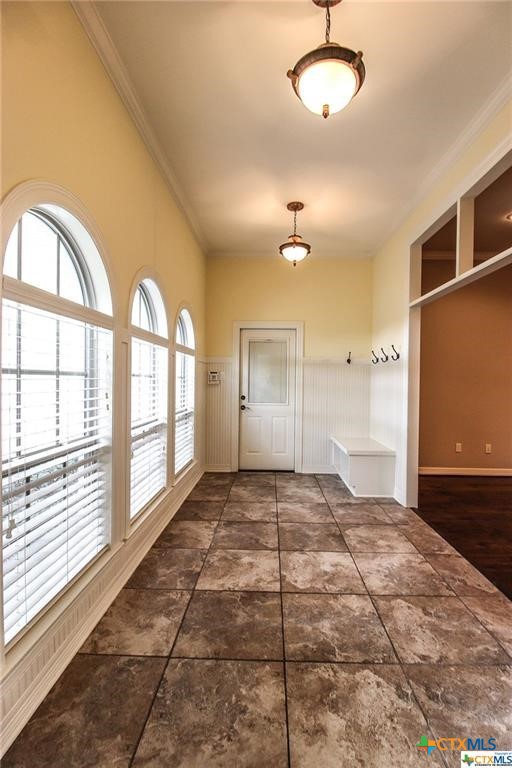 10286 Hartrick Bluff Road Temple, TX 76502 - Photo 39 of 46 a view of an empty room and window and chandelier fan