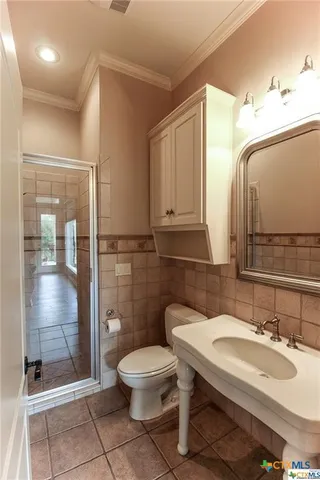 a view of a livingroom with furniture and a window