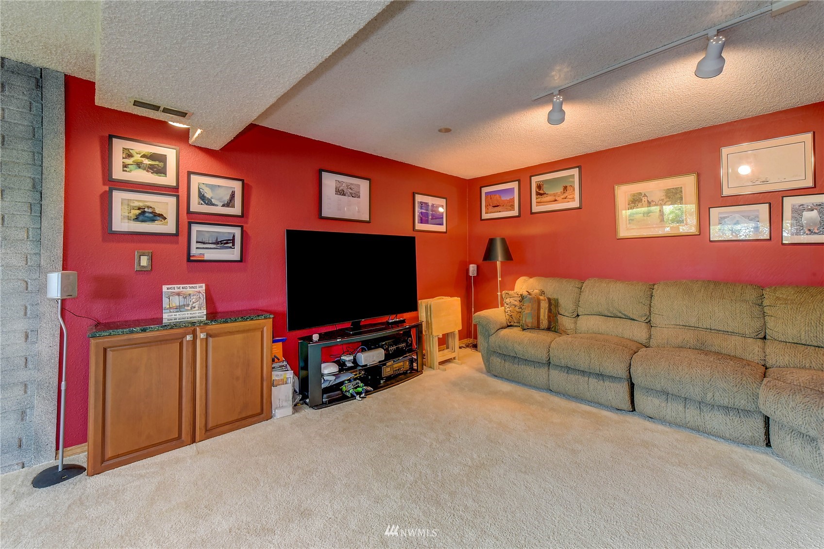 22028 5th Avenue West Bothell, WA 98021 - Photo 14 of 19 a living room with furniture and a flat screen tv