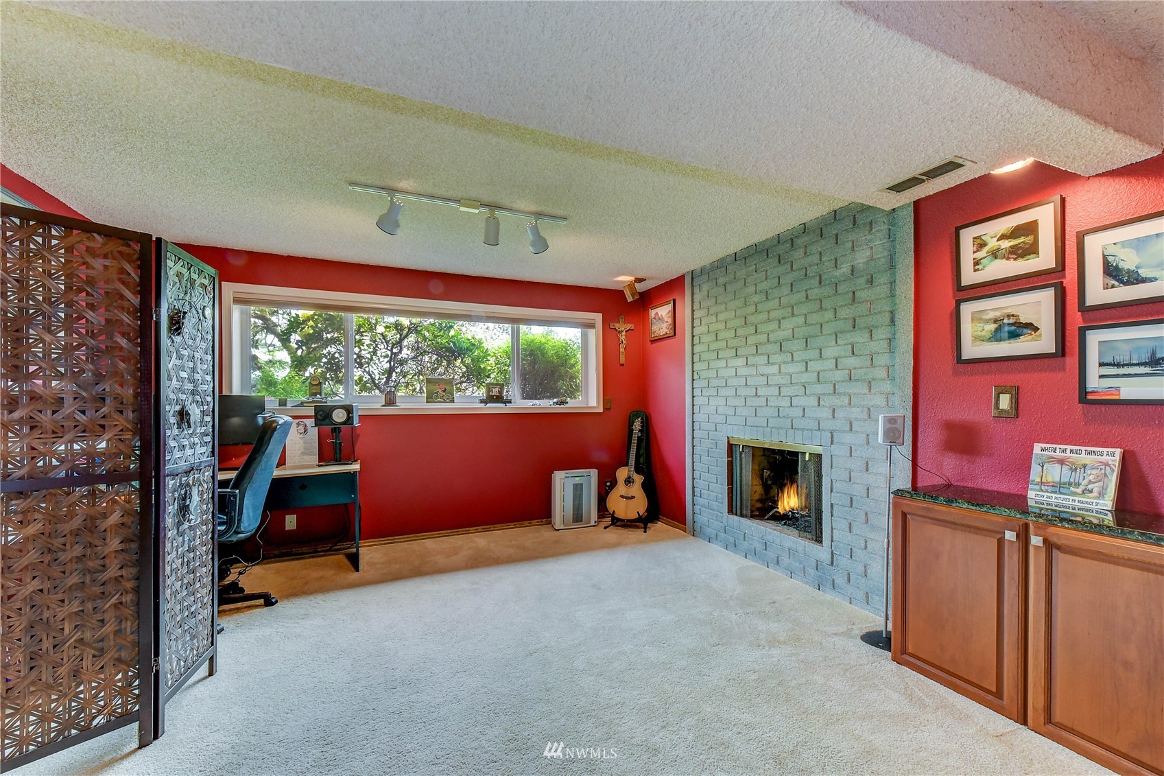 22028 5th Avenue West Bothell, WA 98021 - Photo 15 of 19 a living room with furniture and a fireplace