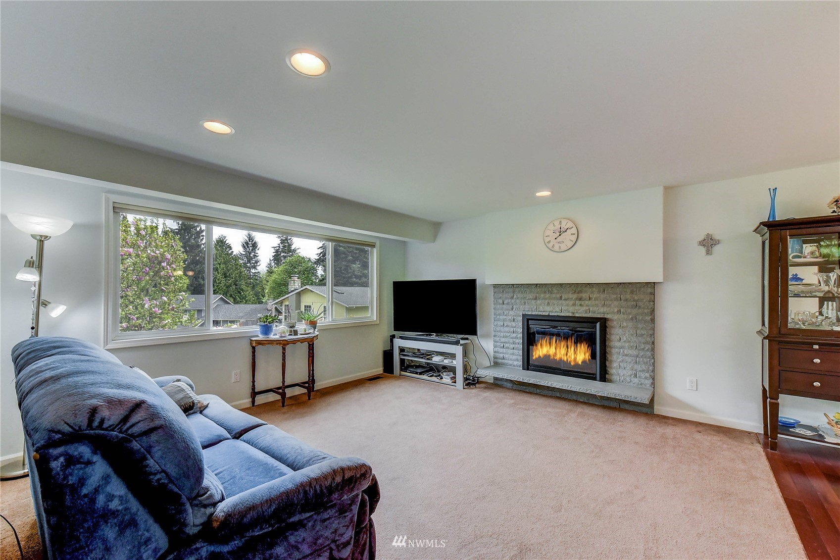 22028 5th Avenue West Bothell, WA 98021 - Photo 2 of 19 a living room with furniture a fireplace and a flat screen tv