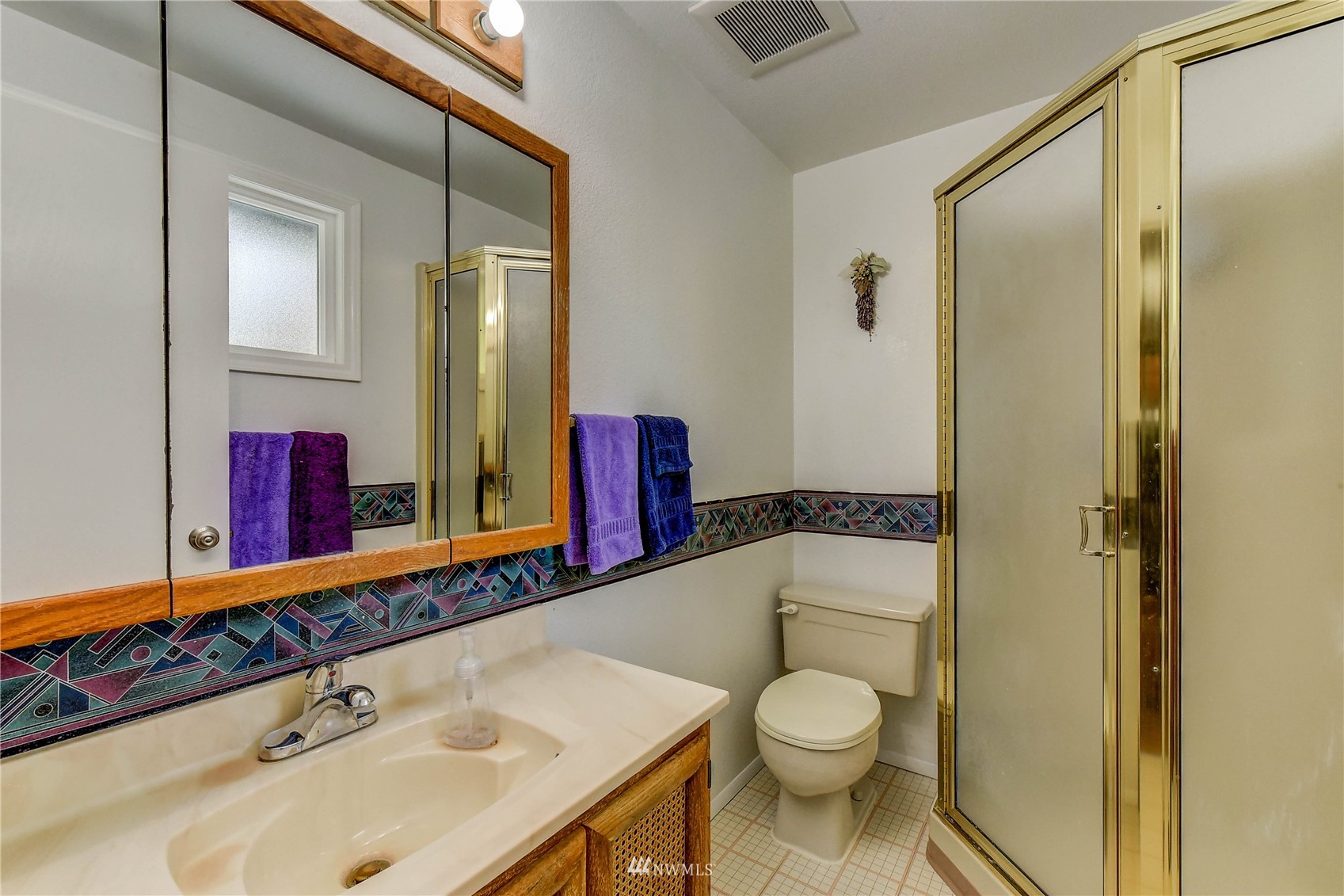 22028 5th Avenue West Bothell, WA 98021 - Photo 8 of 19 a bathroom with a granite countertop toilet sink and mirror