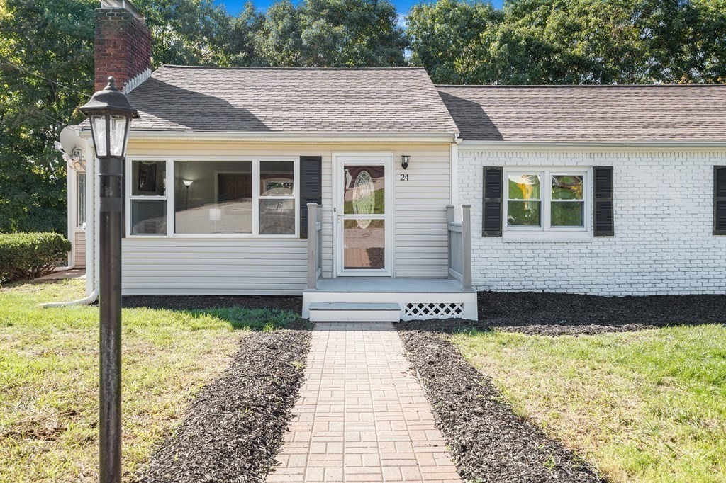 24 Rome Avenue Bellingham, MA 02019 - Photo 38 of 39 a front view of a house with a yard