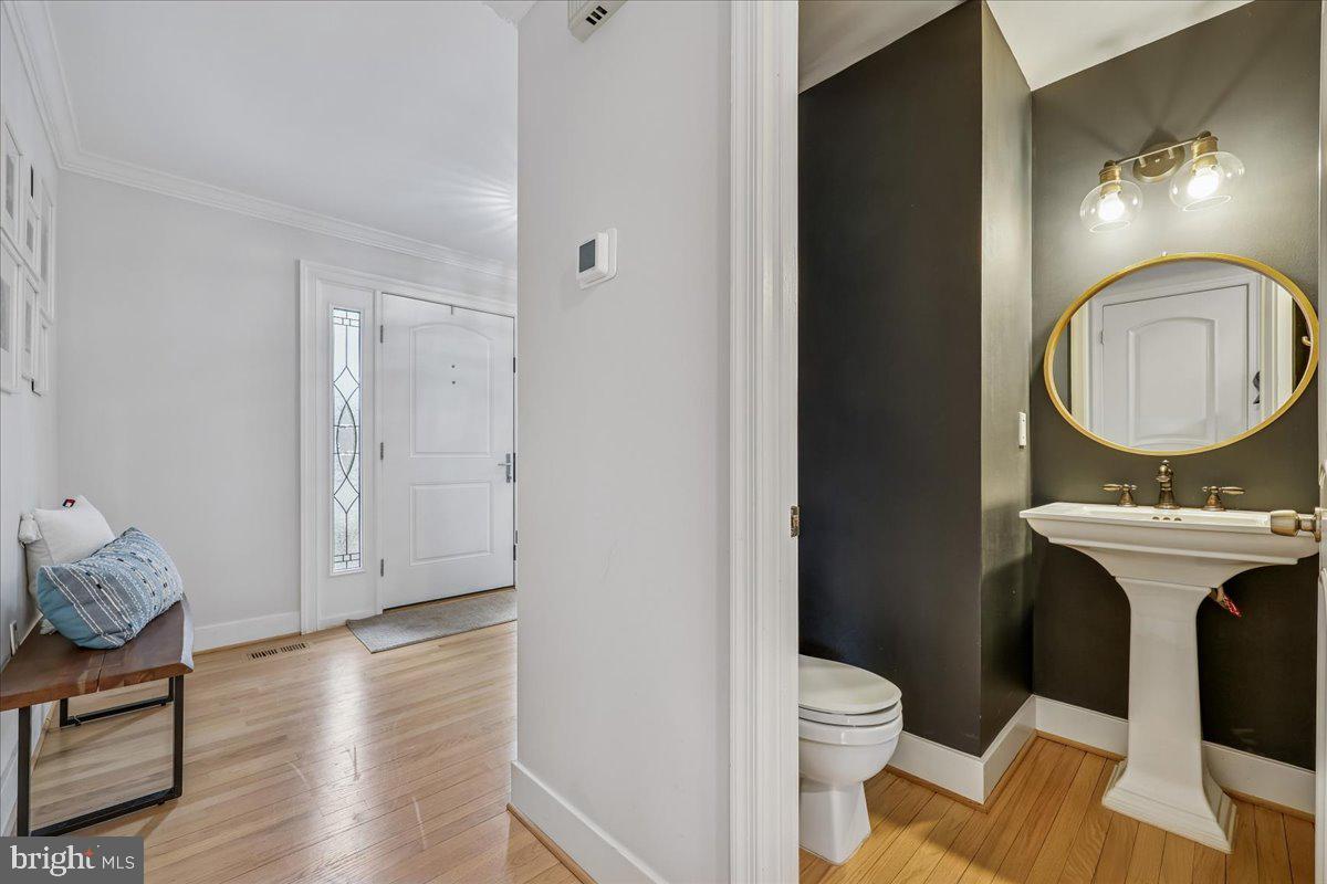 4 Olmstead Court Potomac, MD 20854 - Photo 27 of 48 a bathroom with a toilet a sink and a mirror