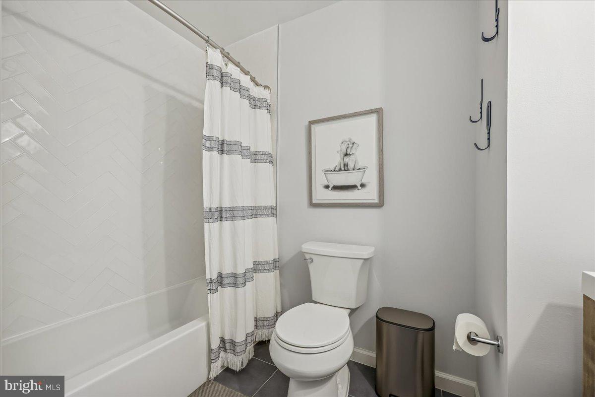 4 Olmstead Court Potomac, MD 20854 - Photo 37 of 48 a white toilet sitting next to a bath tub
