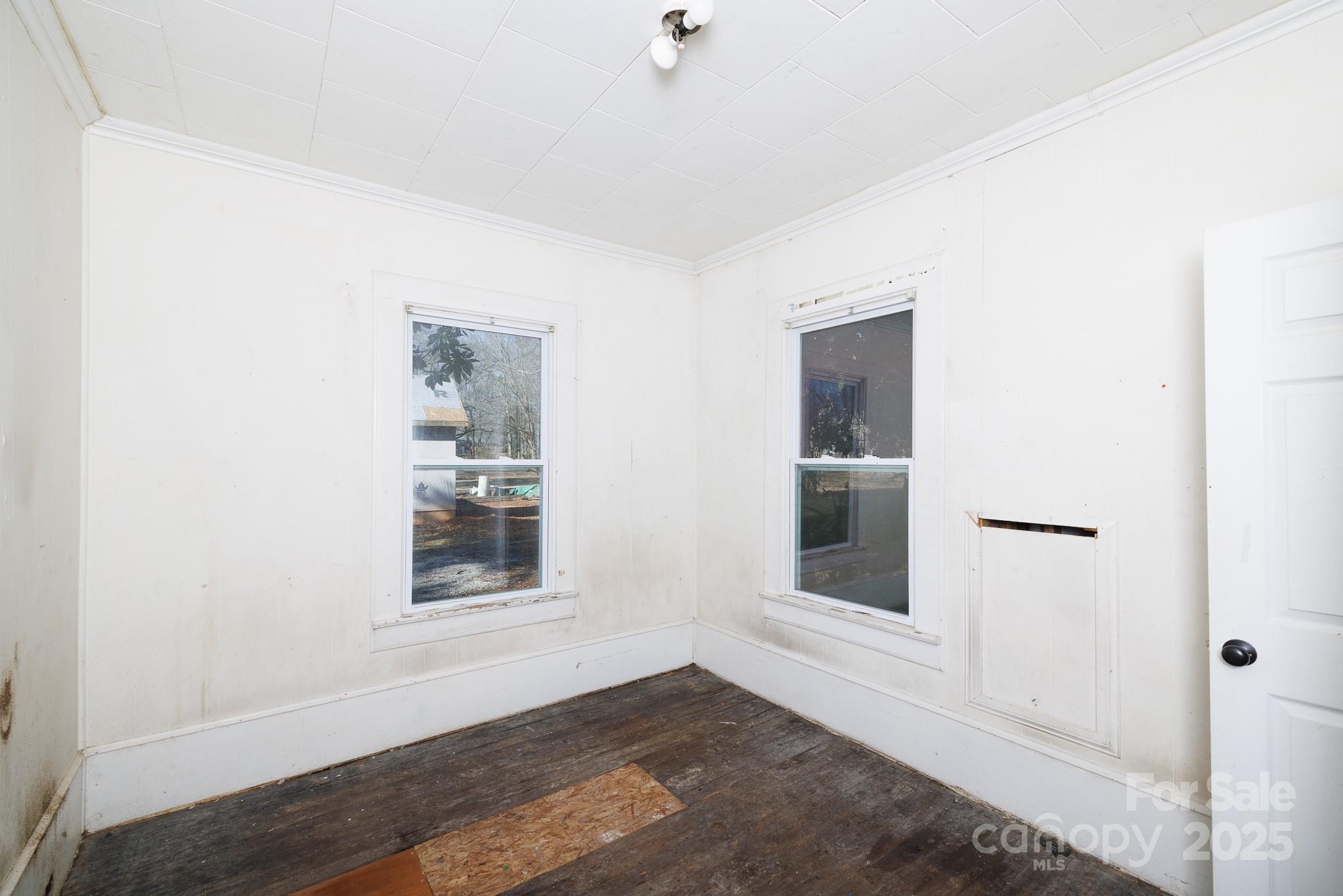 609 Bethel Street Clover, SC 29710 - Photo 16 of 19 a view of an empty room with wooden floor and a window