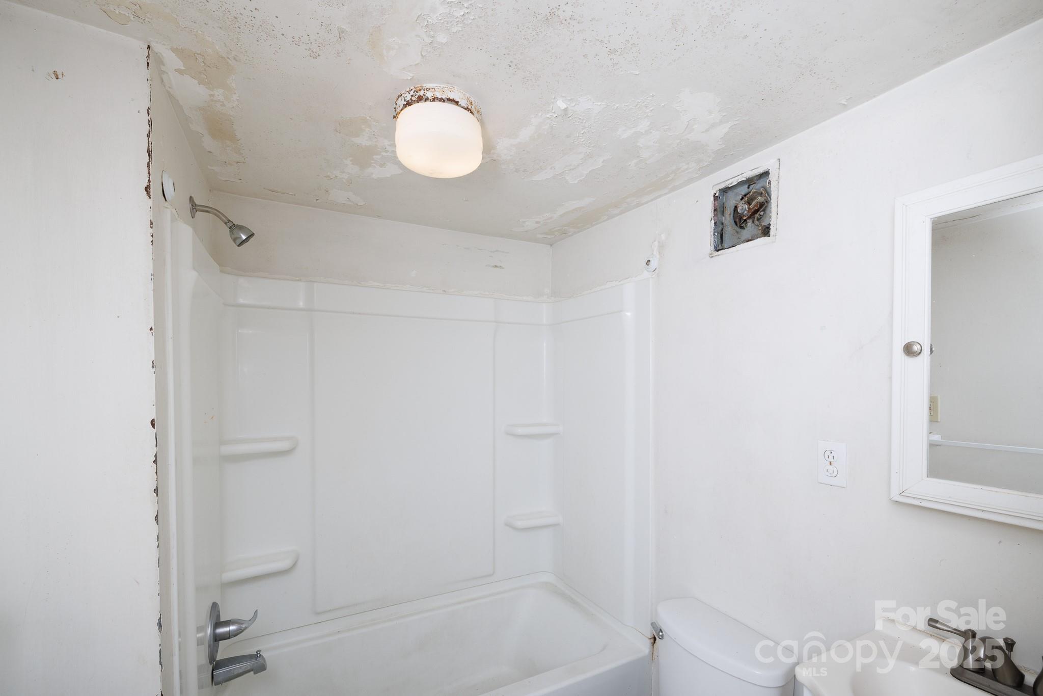 609 Bethel Street Clover, SC 29710 - Photo 18 of 19 a bathroom with a bathtub and shower