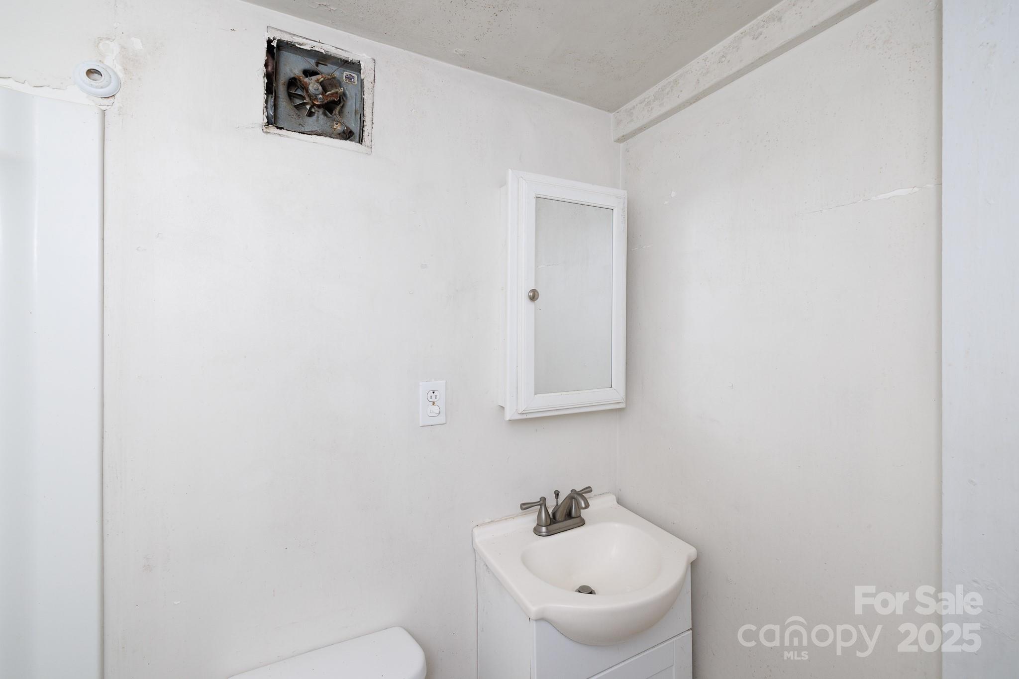 609 Bethel Street Clover, SC 29710 - Photo 19 of 19 a bathroom with a sink and mirror