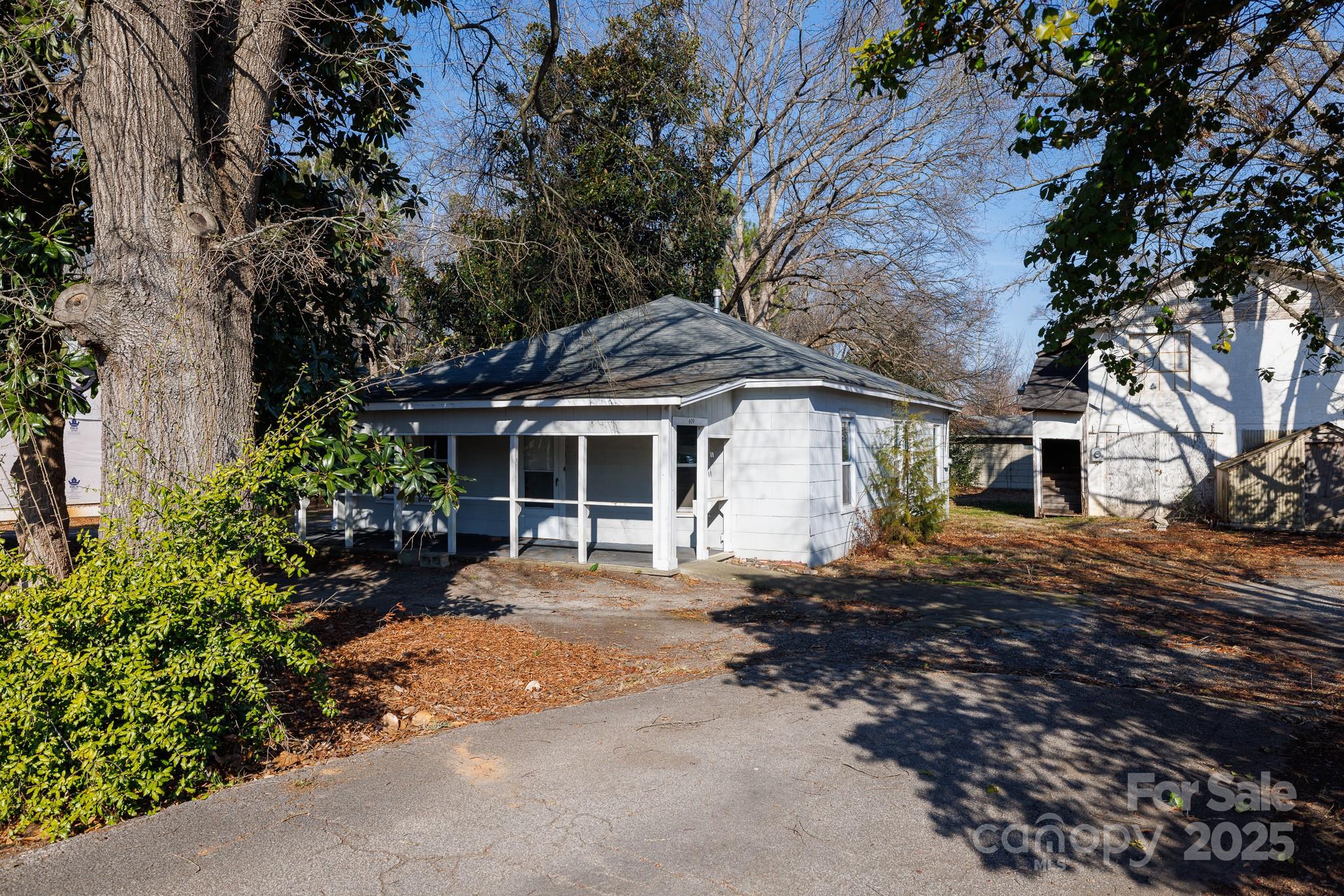 609 Bethel Street Clover, SC 29710 - Photo 2 of 19 a front view of a house with a garden