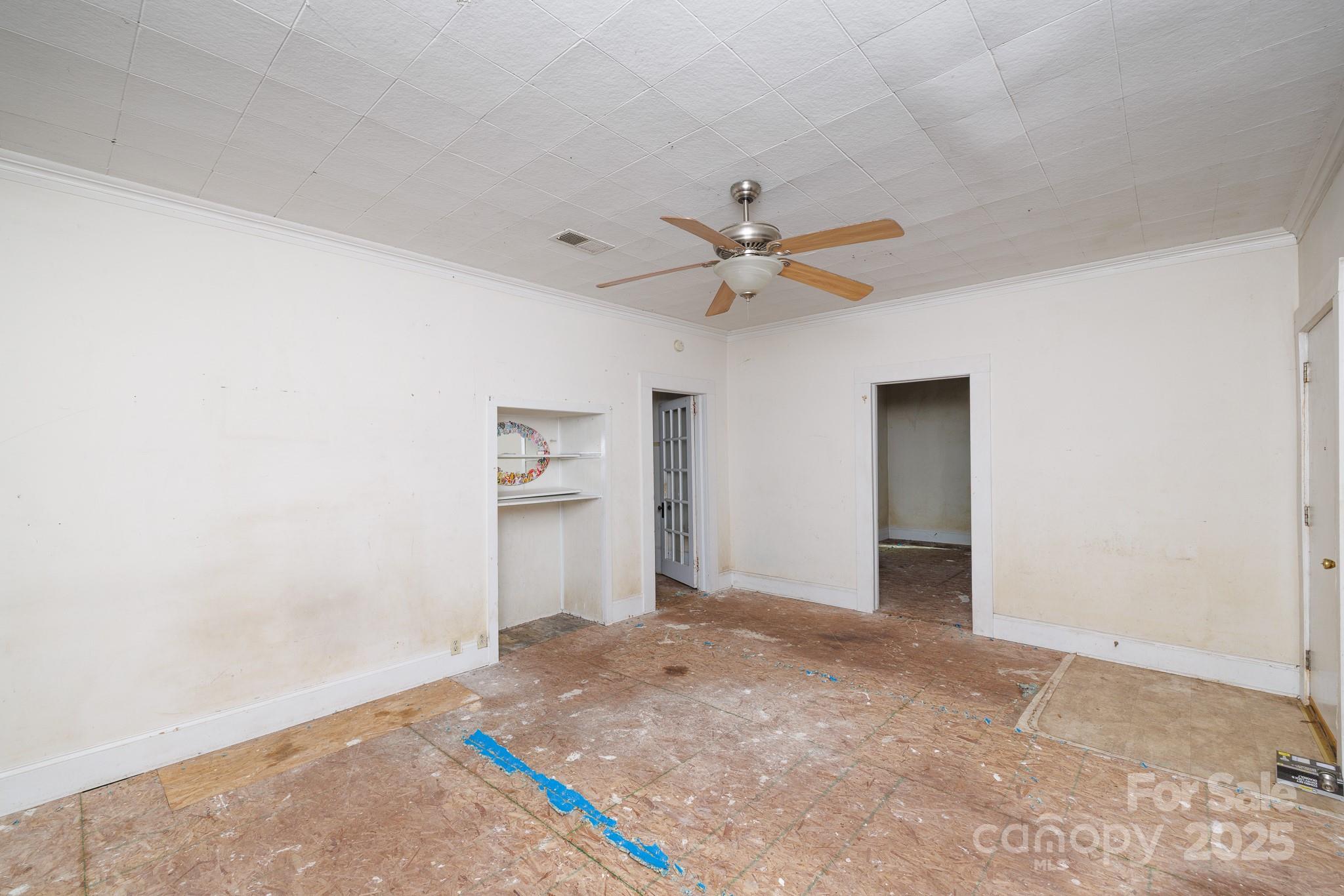 609 Bethel Street Clover, SC 29710 - Photo 7 of 19 an empty room with a ceiling fan and a window