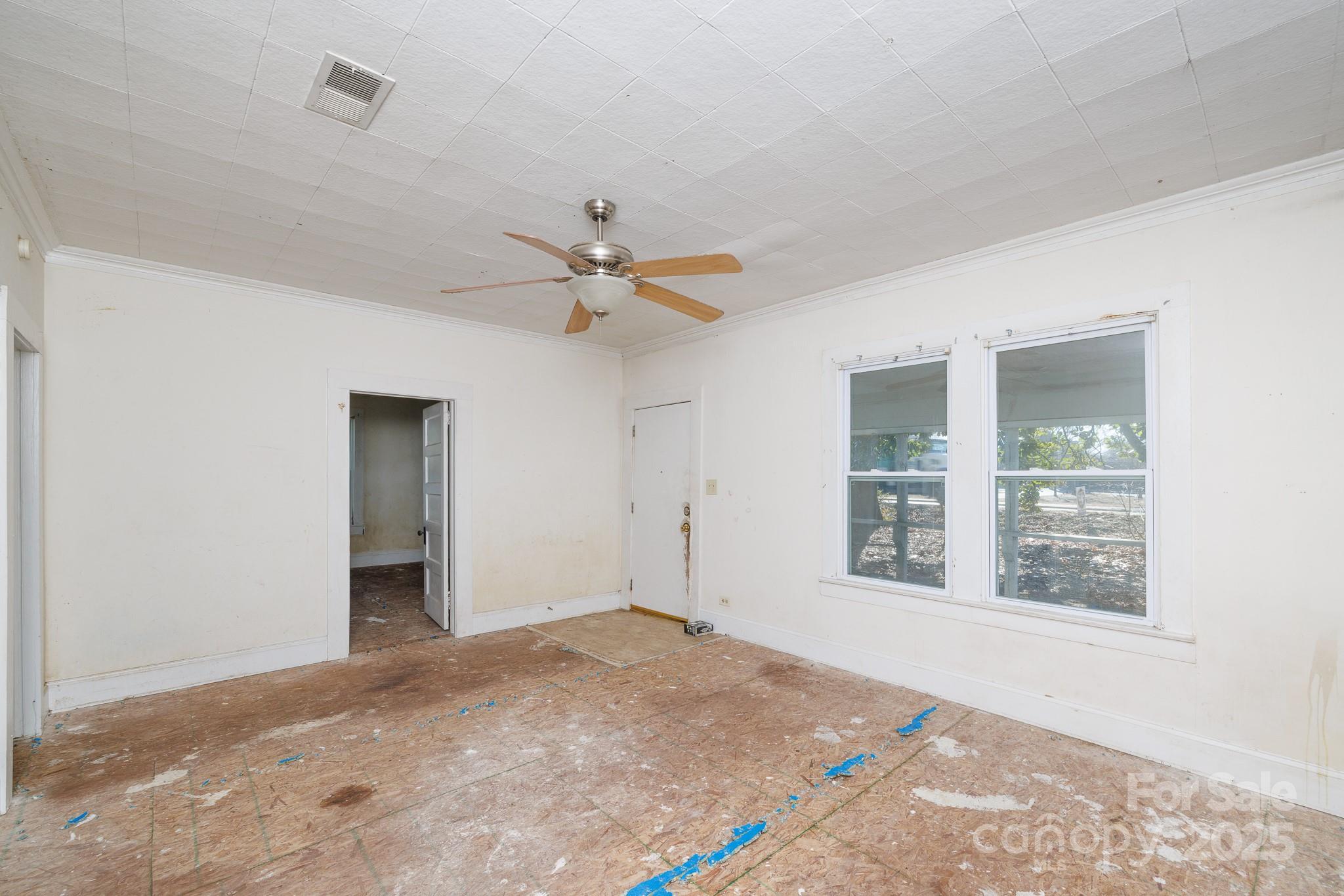 609 Bethel Street Clover, SC 29710 - Photo 8 of 19 a view of a livingroom with a ceiling fan and window