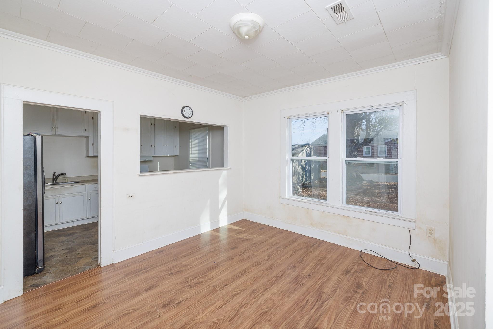 609 Bethel Street Clover, SC 29710 - Photo 9 of 19 a view of an empty room with wooden floor and a window