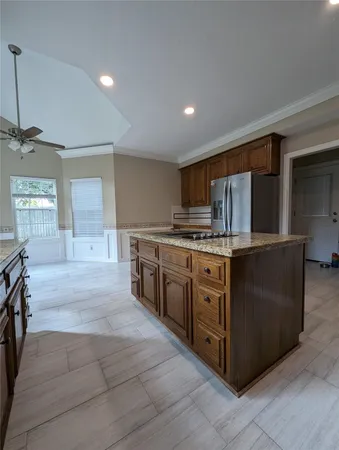 a kitchen with stainless steel appliances granite countertop a stove and a sink