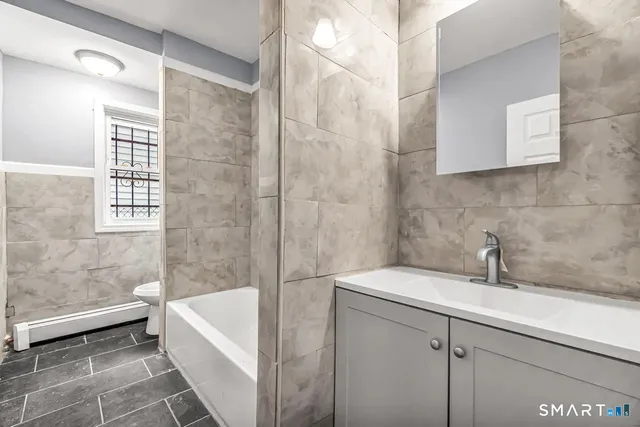 a bathroom with a sink and a bathtub