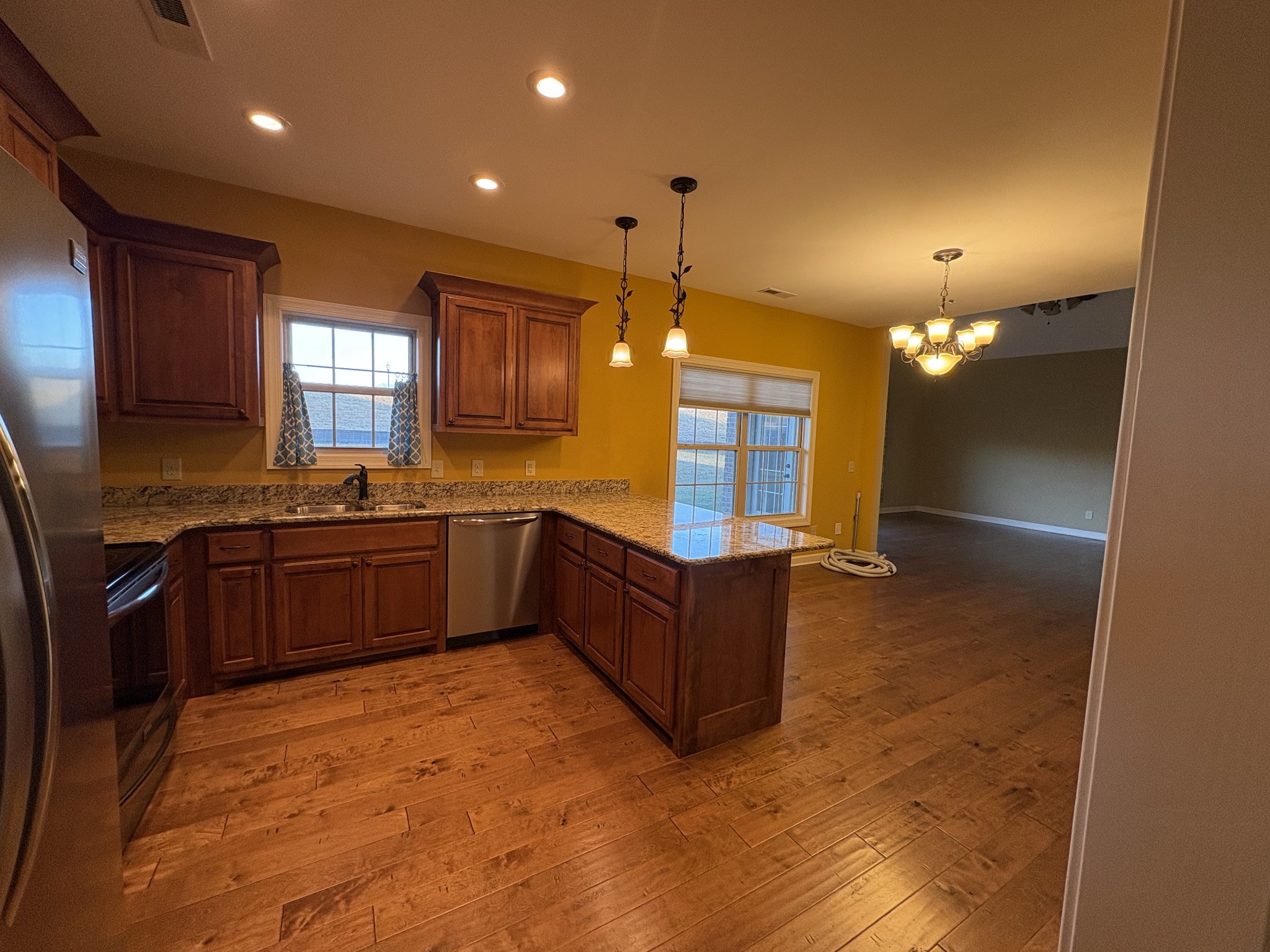 117 Grayson Lane White House, TN 37188 - Photo 11 of 24 a large kitchen with a refrigerator a sink dishwasher and a large mirror