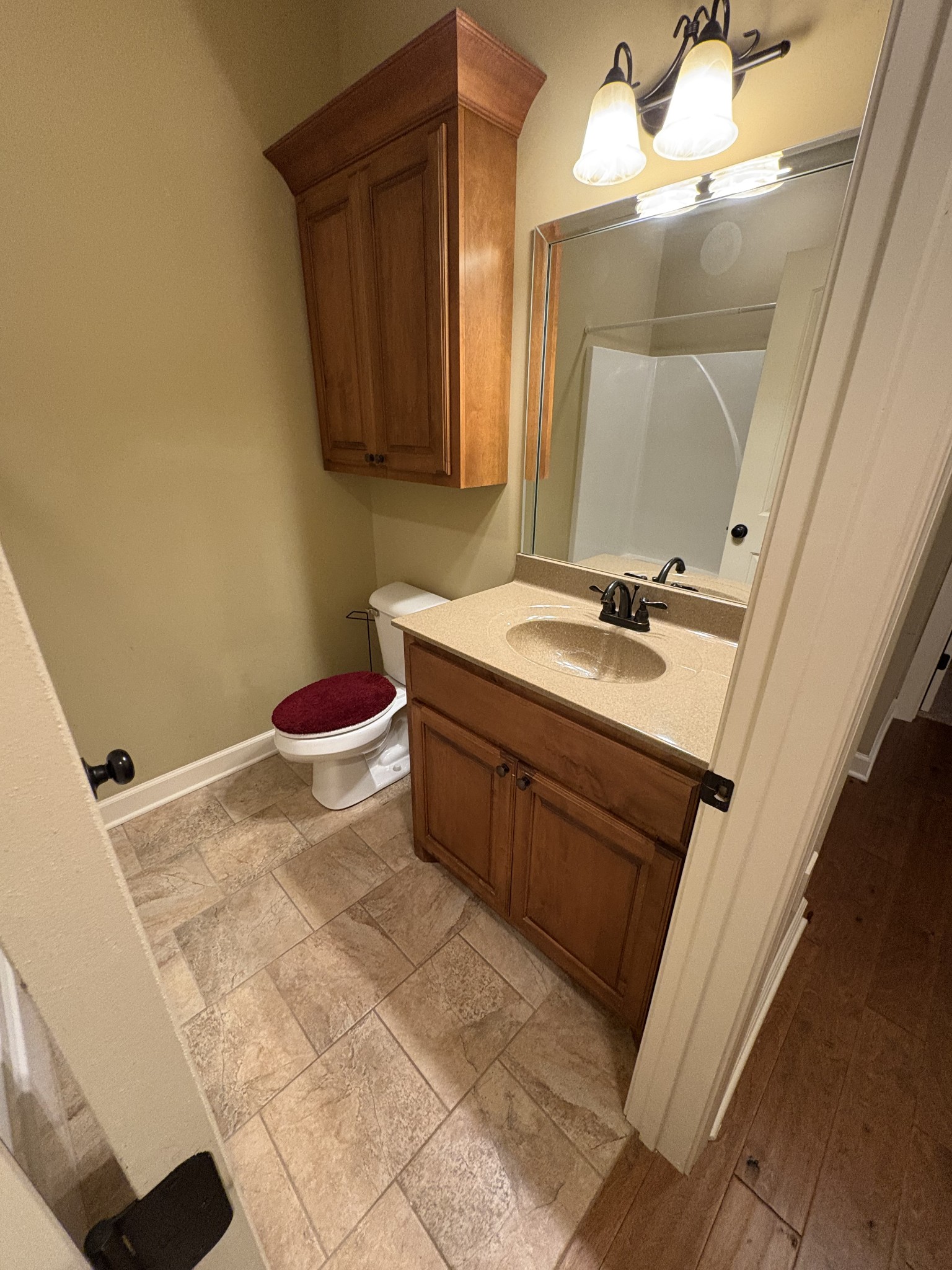 117 Grayson Lane White House, TN 37188 - Photo 19 of 24 a bathroom with a sink a toilet and mirror