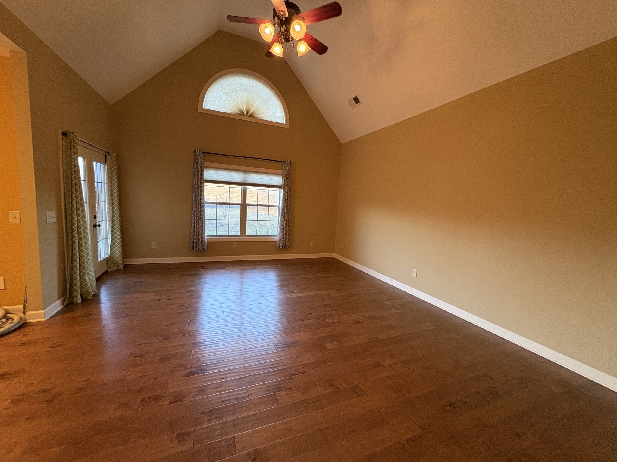 117 Grayson Lane White House, TN 37188 - Photo 2 of 24 an empty room with wooden floor fan and windows