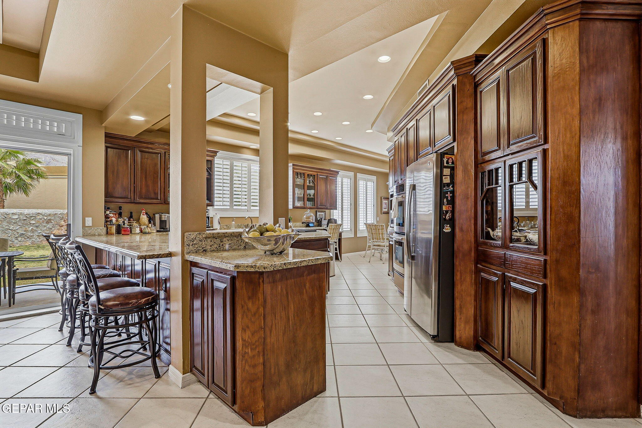 5806 Diamond Point Circle El Paso, TX 79912 - Photo 12 of 61 a kitchen with stainless steel appliances granite countertop a stove and a refrigerator