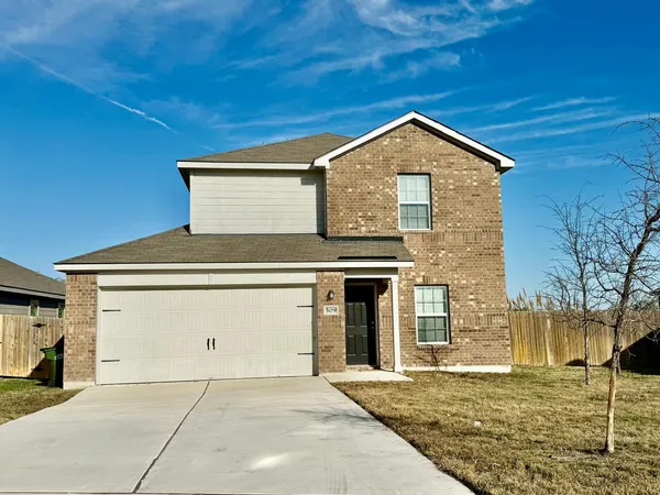 a front view of a house with garage