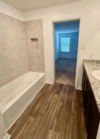 a bathroom with a sink and a mirror