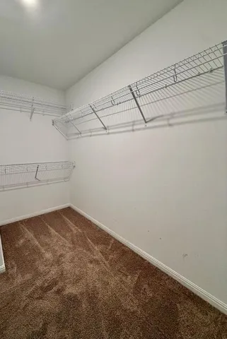 a bathroom with a granite countertop sink and a bathtub