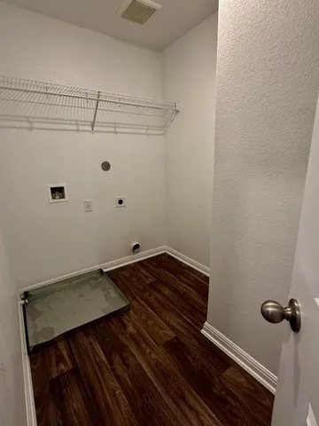 a view of a room with racks on the wall