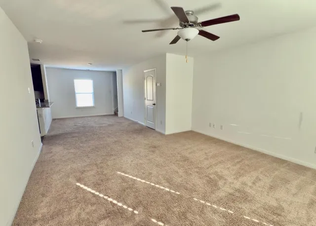 a view of kitchen appliances and cabinets