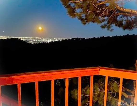 a view of a yard with wooden fence