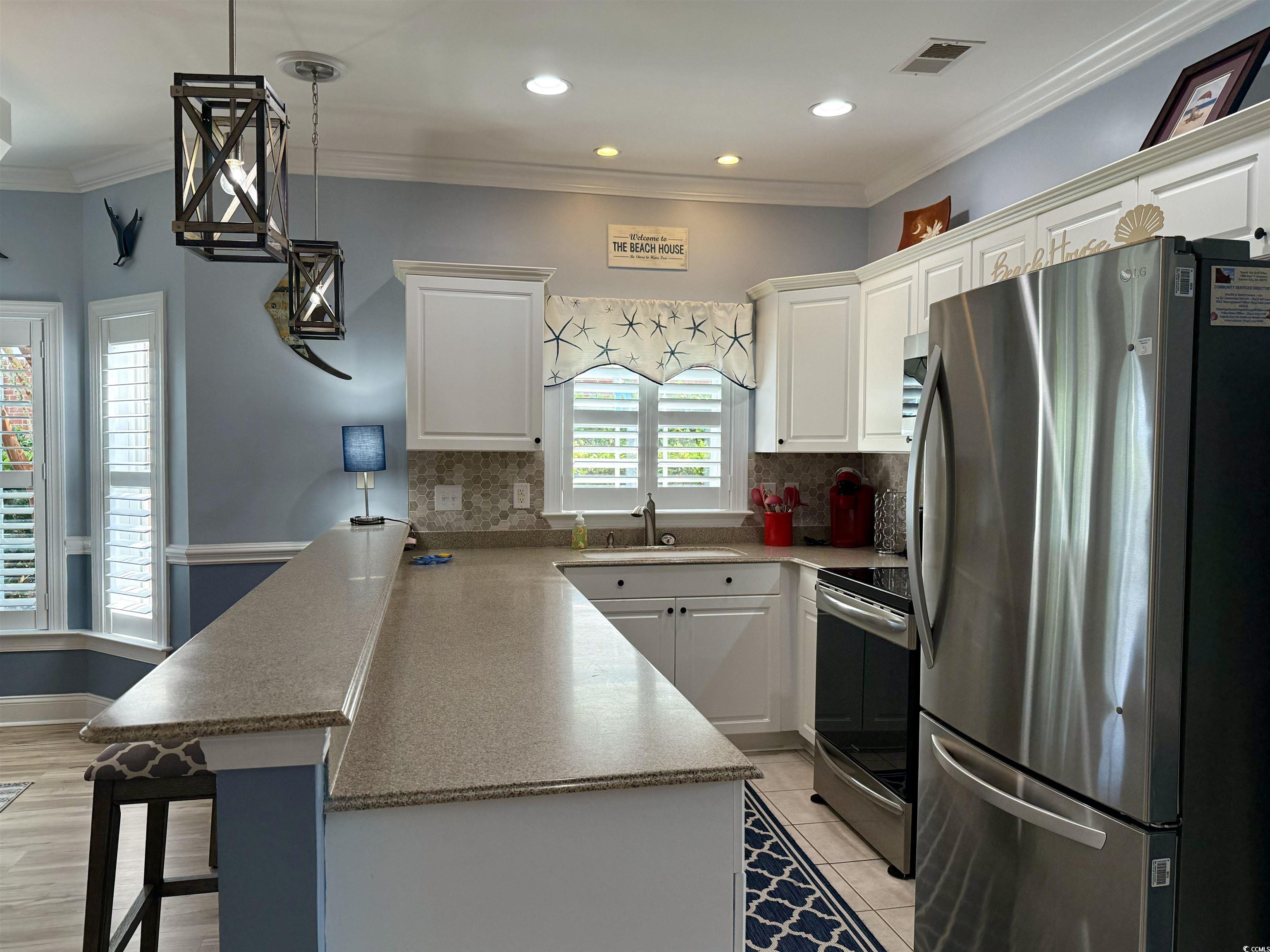 1008 Ray Costin Way, Unit 305 Murrells Inlet, SC 29576 - Photo 11 of 31 Kitchen with stainless steel appliances, ornamenta